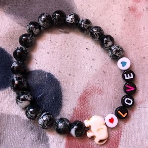 Glass beaded love and elephant bracelet
